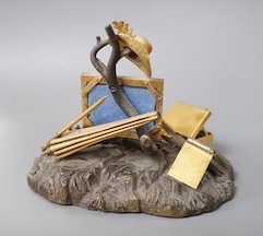 A 19th century Swiss gilt bronze, enamel, gem and paste mounted tableau of an artist's equipment, maker’s mark Malignon a Geneve, 11cm